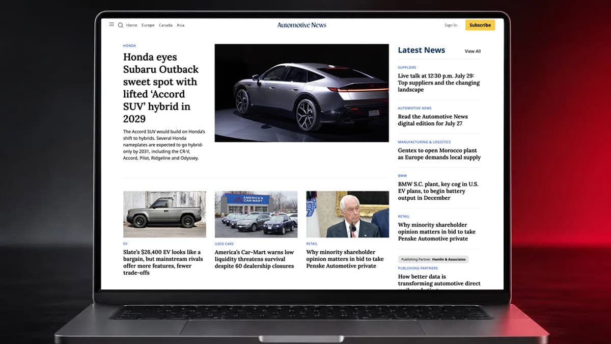 The Automotive News homepage on a laptop